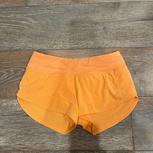 Lululemon orange running shorts